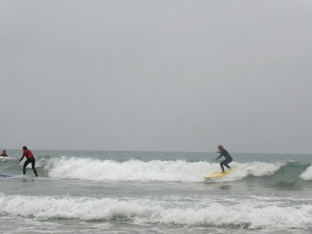 Laura and I catching the same wave