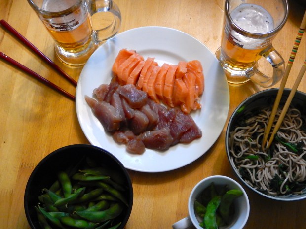 Tonight's meal of sashimi, buckwheat noodles with a fig soup and spinach, endame beans and a beer.